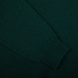 A close up of a dark green William Lockie Tartan Green Lambswool V-Neck Sweater.