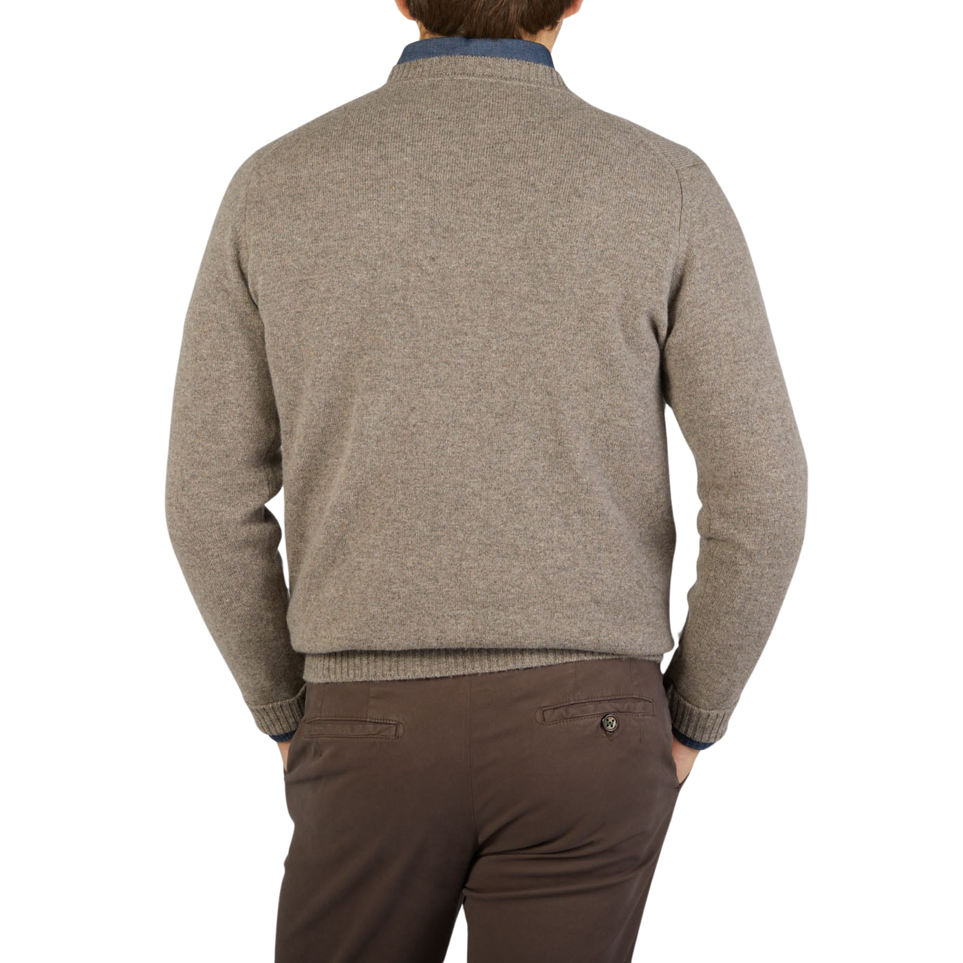 The back view of a man wearing a cozy William Lockie Vole Beige Crew Neck Lambswool Sweater.
