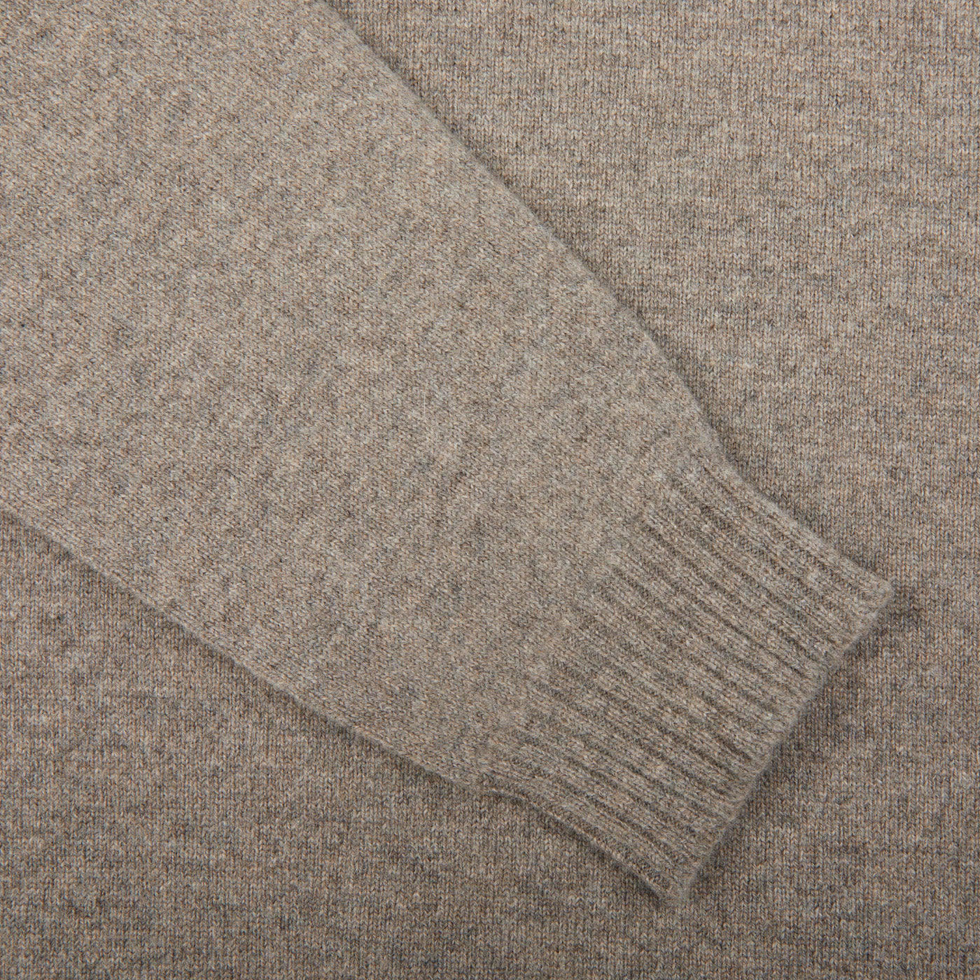 A close up of a William Lockie Vole Beige Crew Neck Lambswool Sweater.