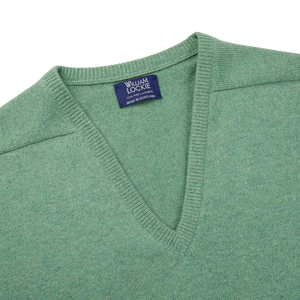 A Green Mix V-Neck Cashmere Sweater made of Scottish cashmere with a William Lockie label.