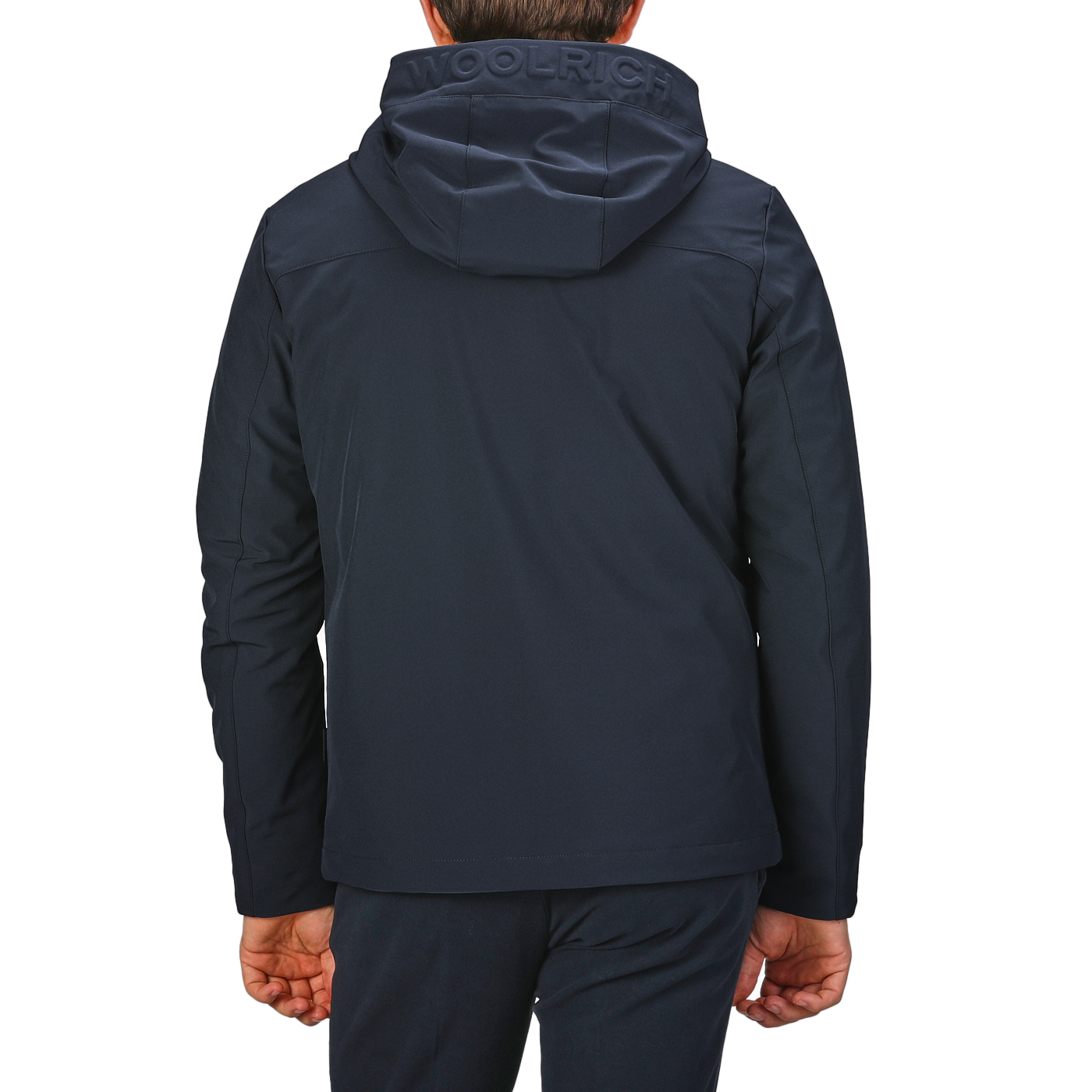 Back view of a person wearing a Melton Blue Pacific hooded jacket with "Woolrich" on the hood.