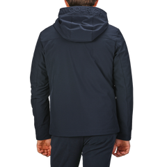 Back view of a person wearing a Melton Blue Pacific hooded jacket with "Woolrich" on the hood.