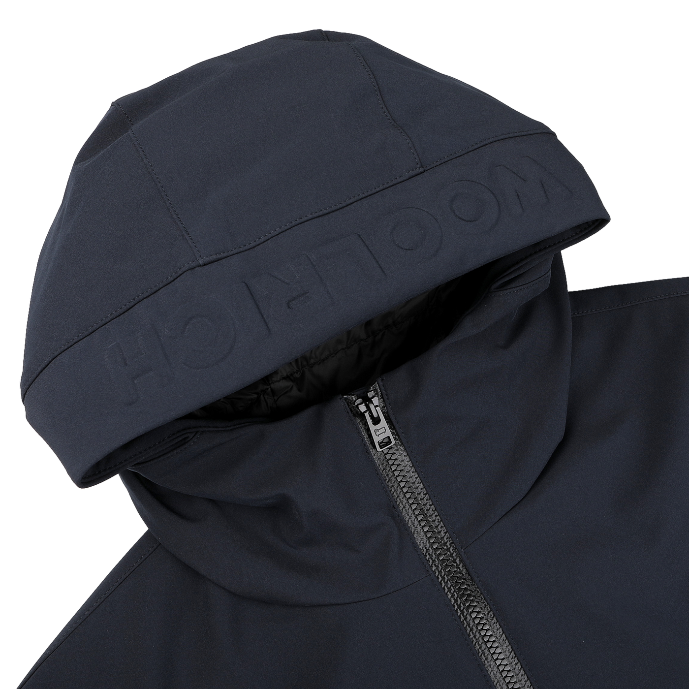 A close-up of the Woolrich Melton Blue Pacific Soft Shell Jacket showcases a visible zipper and embossed branding on the hood. The sleek, dark design conveys modernity and functionality, making it perfect for any adventure.