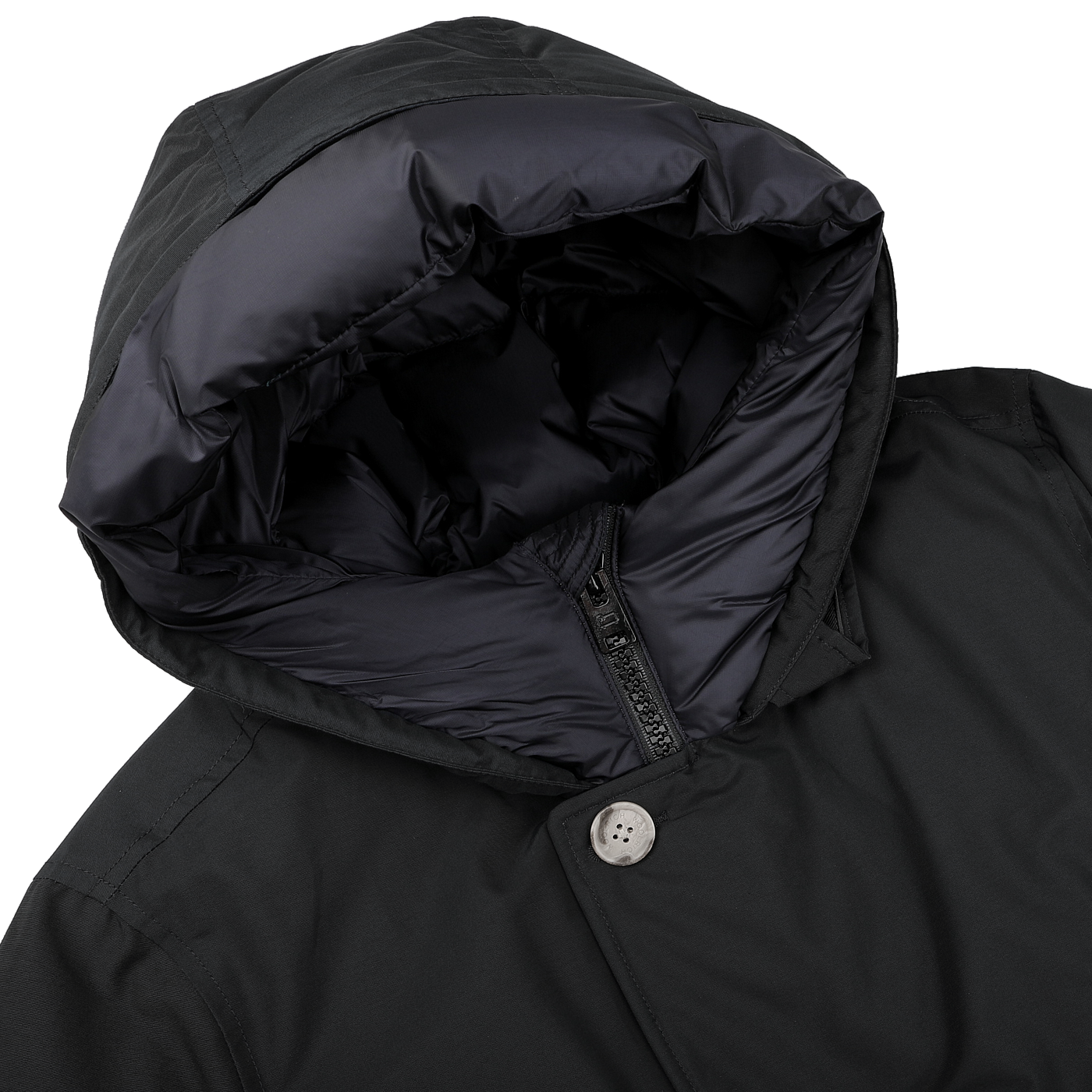 Close-up of the Woolrich Melton Blue Stretch Nylon Arctic Parka, showcasing its insulated puffy lining made from duck down and feathers, along with a waterproof stretch nylon exterior and a single visible button.