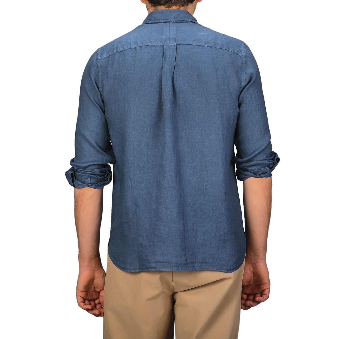 Someone wearing a Dark Blue Washed Linen Legacy Shirt by Xacus and beige pants, seen from behind.