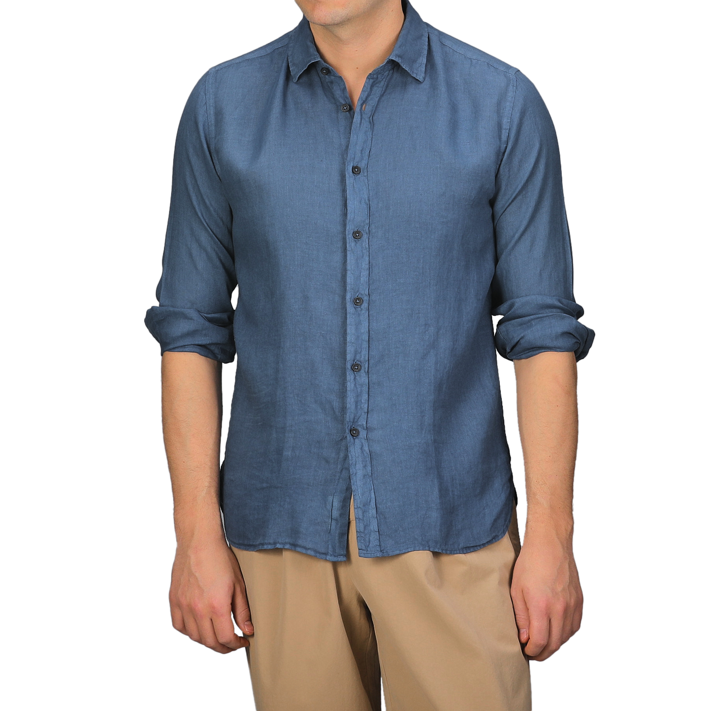 A person wearing a Dark Blue Washed Linen Legacy Shirt by Xacus with rolled-up sleeves and beige pants.