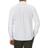 A person wearing a White Cotton Twill Legacy Shirt by Xacus and dark green pants is shown from the back against a plain gray background.