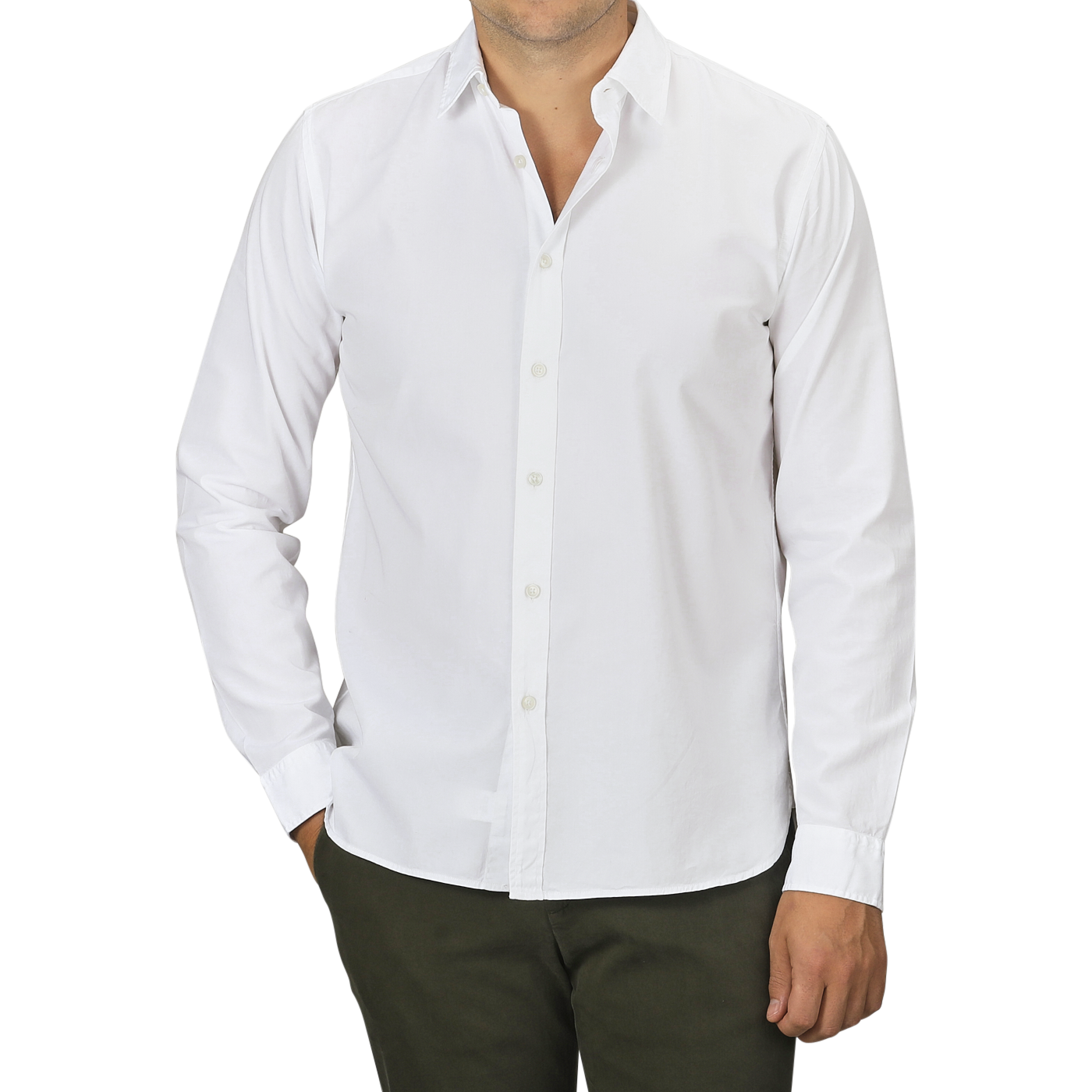 A person wearing a slim fit White Cotton Twill Legacy Shirt by Xacus and dark green pants stands with one hand in their pocket. The individual's face is not visible.