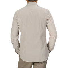 A person wearing a long-sleeved, Xacus Light Beige Cotton Corduroy Tailor Fit Shirt is seen from the back, standing against a plain background.