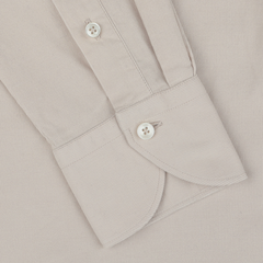 Close-up of the Xacus Light Beige Cotton Corduroy Tailor Fit Shirt cuff with two white buttons on a white background. The pure cotton corduroy fabric appears textured.