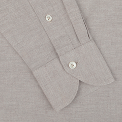 Close-up of the Light Beige Cotton Flannel Tailor Fit Shirt sleeve by Xacus, showcasing two white buttons—one on the cuff and one near the wrist. The pure cotton flannel fabric features a subtle textured pattern.