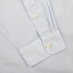 Close-up of the Light Blue Cotton Twill Legacy Shirt by Xacus, showcasing its sleeve with two white cuff buttons laid flat.