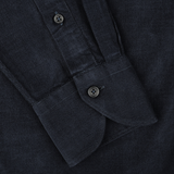 Close-up of a cuff on the Xacus Navy Blue Cotton Corduroy Tailor Fit Shirt, showcasing its pure cotton corduroy texture and featuring two black buttons.