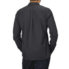 Back view of a person wearing a navy blue long-sleeve button-up shirt made from pure cotton twill by Xacus and matching pants.