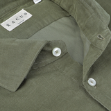 Close-up view of the Olive Green Cotton Corduroy Tailor Fit Shirt with white buttons, showcasing a label with the brand name "Xacus.