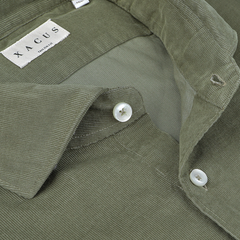 Close-up view of the Olive Green Cotton Corduroy Tailor Fit Shirt with white buttons, showcasing a label with the brand name "Xacus.