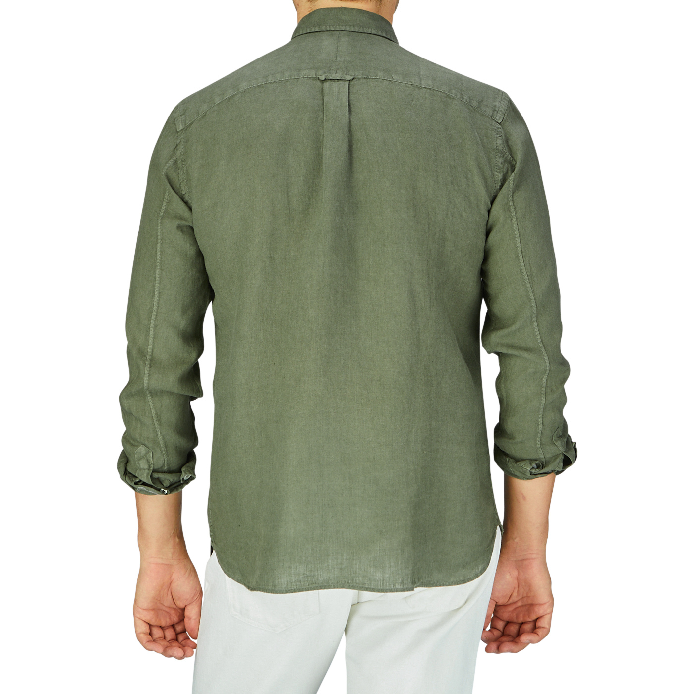 A person standing with their back to the camera, wearing an Xacus Olive Green Washed Linen Legacy Shirt with a cut-away collar and white pants.