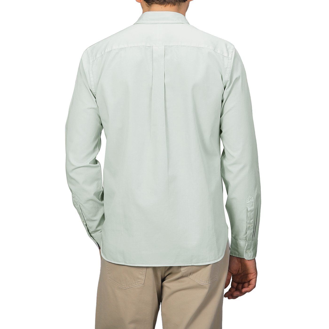 A person is seen from the back wearing Xacus's Sage Green Cotton Twill Legacy Shirt and beige pants against a gray background.