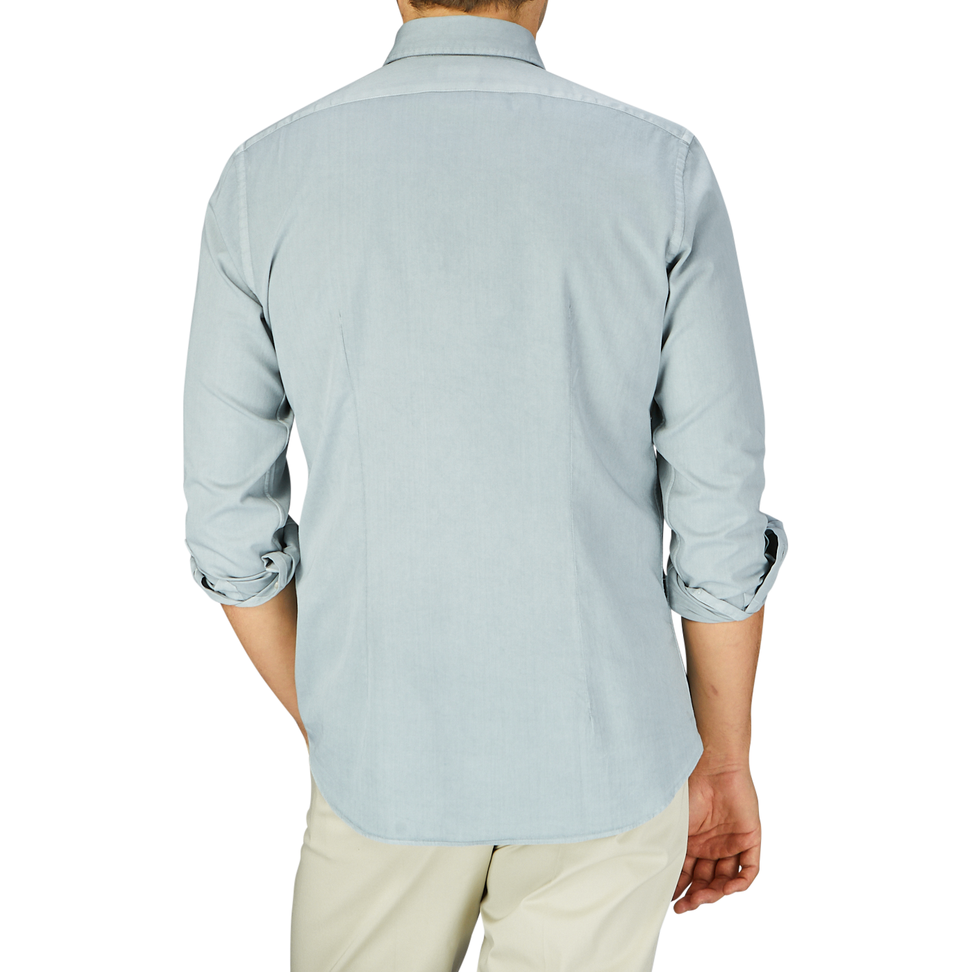 Man seen from behind wearing a Xacus Sage Green Cotton Twill Tailor Fit Shirt and beige pants.