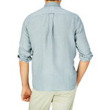 Person wearing an Xacus Sage Green Washed Linen Legacy Shirt, viewed from the back.
