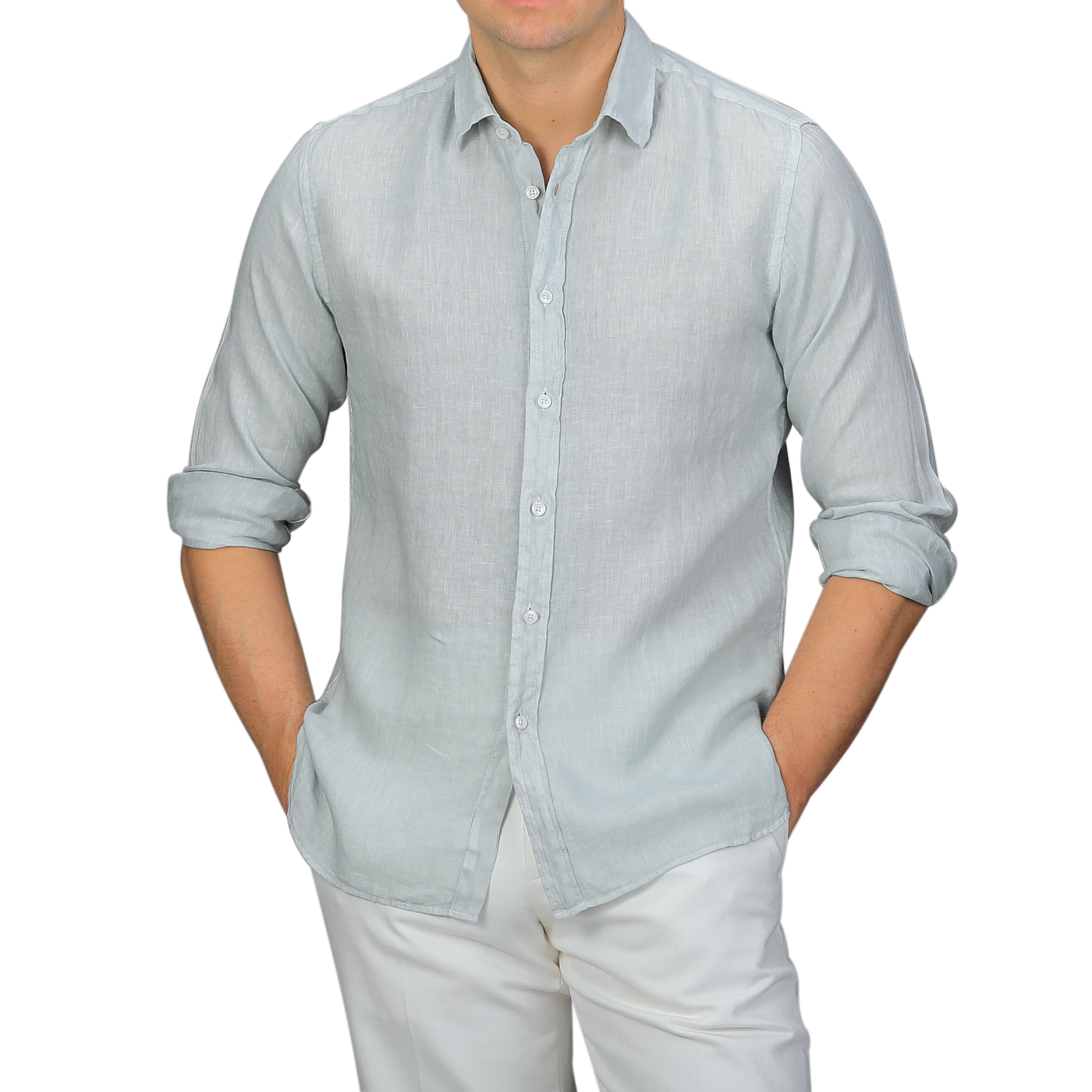 A person wearing the Xacus Sage Green Washed Linen Legacy Shirt with rolled-up sleeves and white pants, showcasing a stylish cut-away collar against a plain background.