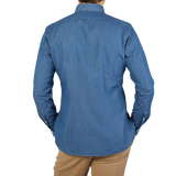 The back view of a man wearing a Xacus Slim Fit, Washed Blue Cotton Denim Casual Shirt.