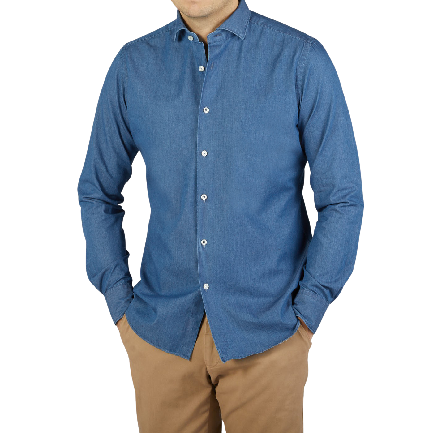 A man wearing a Xacus slim fit washed blue cotton denim casual shirt paired with tan pants.