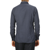 A person wearing a Washed Navy Mussola Cotton Tailor Fit Shirt by Xacus is shown from the back. Only the upper half of the body is visible.