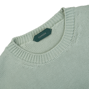A Aqua Green Cotton Crew Neck Sweater by Zanone with a label on it.