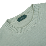 A Aqua Green Cotton Crew Neck Sweater by Zanone with a label on it.