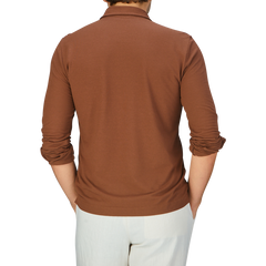 The back view of a man wearing a coffee brown Zanone Ice Cotton LS Polo Shirt.