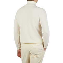 The back view of a man wearing an Ecru Beige Wool Cashmere Zanone rollneck sweater.