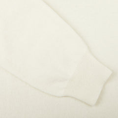 A close-up of a white Zanone Ecru Beige Wool Cashmere Rollneck sweater on a white surface.