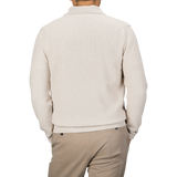 A person wearing the Zanone Ecru Beige Wool Winter LS Polo Shirt and beige pants is shown from the back.