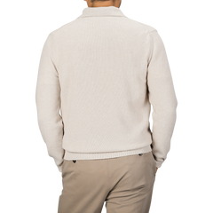 A person wearing the Zanone Ecru Beige Wool Winter LS Polo Shirt and beige pants is shown from the back.