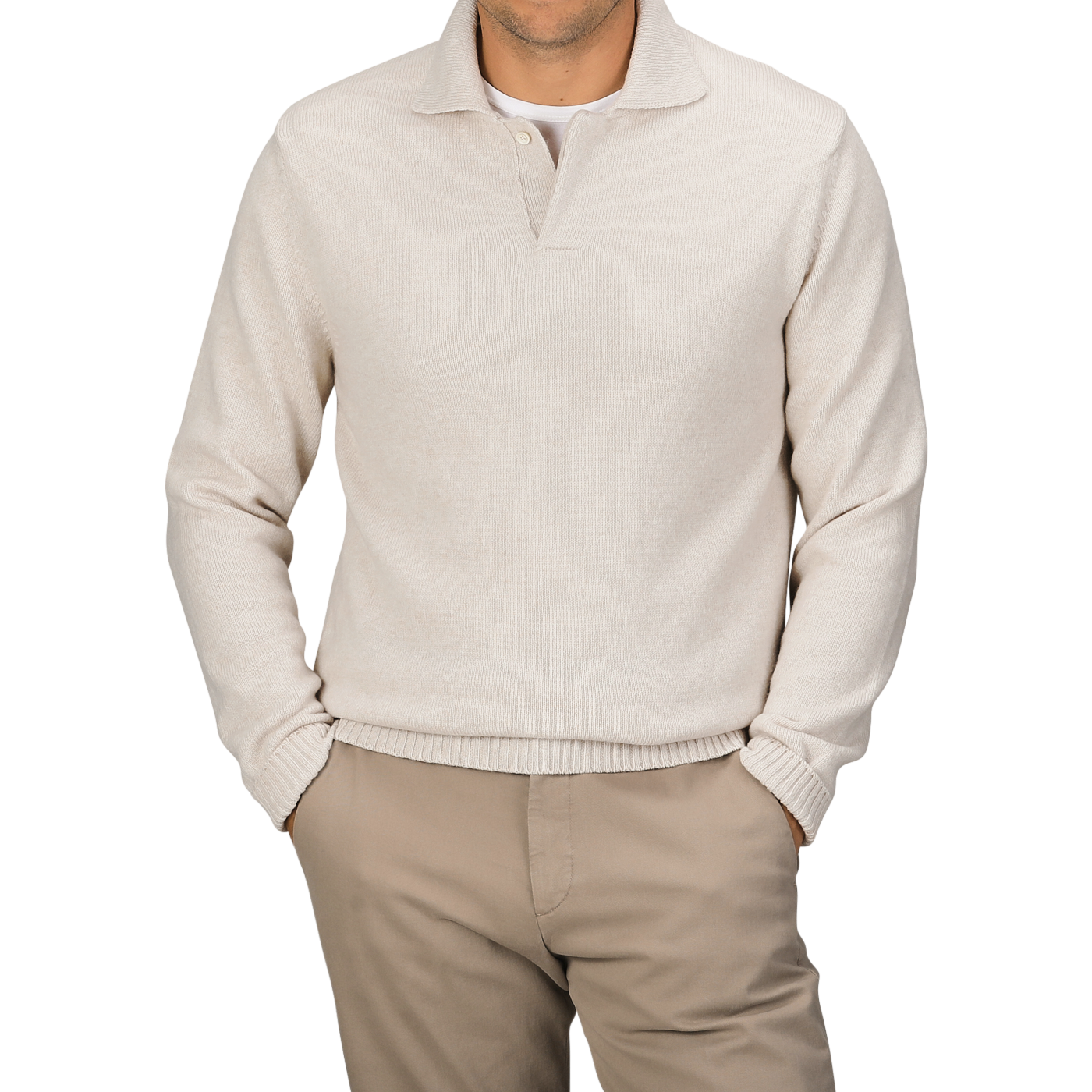 A person wearing an Ecru Beige Wool Winter LS Polo Shirt by Zanone, featuring a regular fit and long sleeves made of pure virgin wool, paired with beige pants and both hands in their pockets.