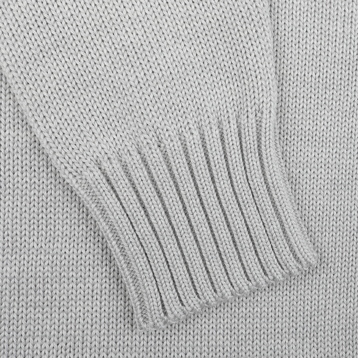 Close-up of the Light Grey Merino Wool Button Cardigan by Zanone, highlighting its ribbed detailing and luxurious texture, possibly seen on a sweater sleeve.