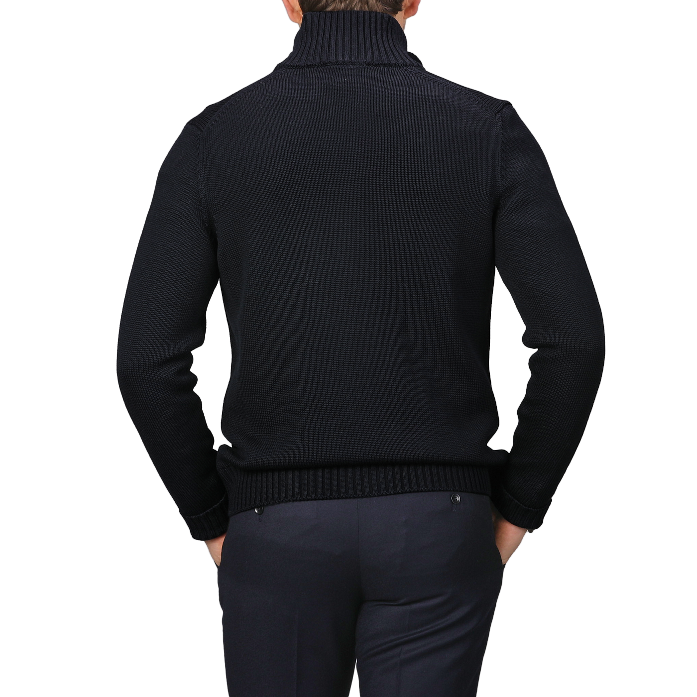 A person in a navy blue button cardigan made of merino wool from Zanone, shown from the back, stands against a gray background. Subtle sophistication meets timeless style with this chic ensemble.