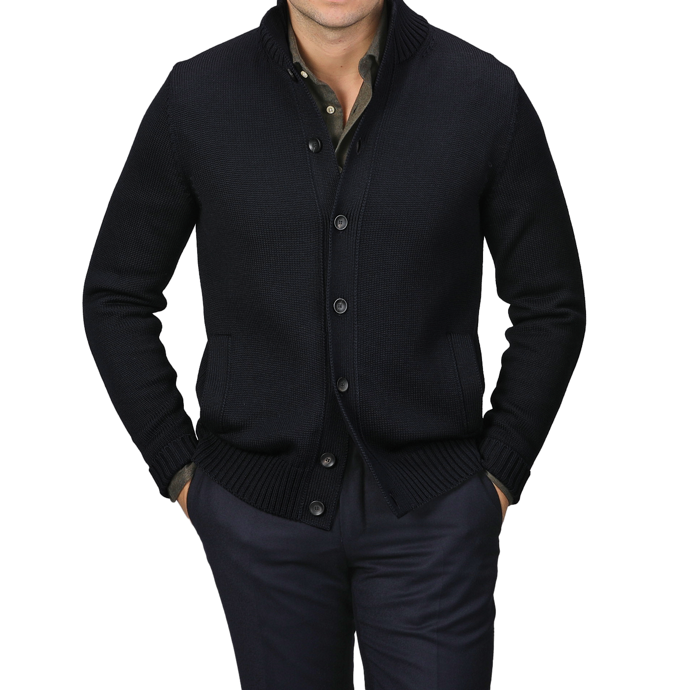 A person in a Zanone Navy Blue Merino Wool Button Cardigan, styled over a dark shirt and pants with hands casually tucked in pockets, stands against a gray background.