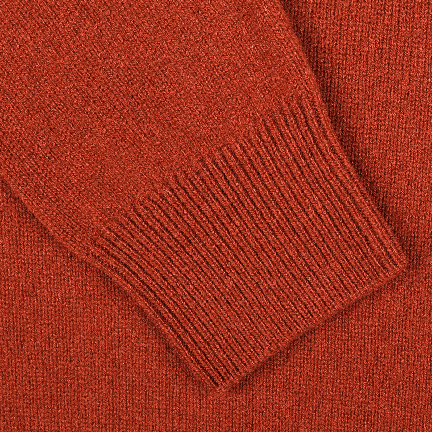 Close-up of a Zanone Rust Red Wool Quarter Zip Sweater, showcasing the intricate ribbed cuff detailing on its long sleeves.