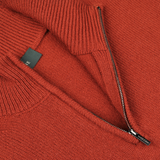 Close-up of a Rust Red Wool Quarter Zip Sweater by Zanone with a visible brand tag.