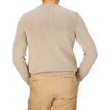 The back view of a man wearing tan pants and a Zanone Taupe Beige Cotton Crew Neck Sweater.