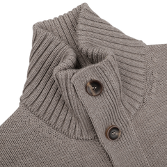 Close-up of a Zanone cardigan showcasing a taupe beige merino wool texture with a high collar and two dark buttons.