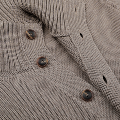 Close-up of the Taupe Beige Merino Wool Button Cardigan by Zanone, expertly crafted from soft merino wool with four vertically arranged brown buttons.