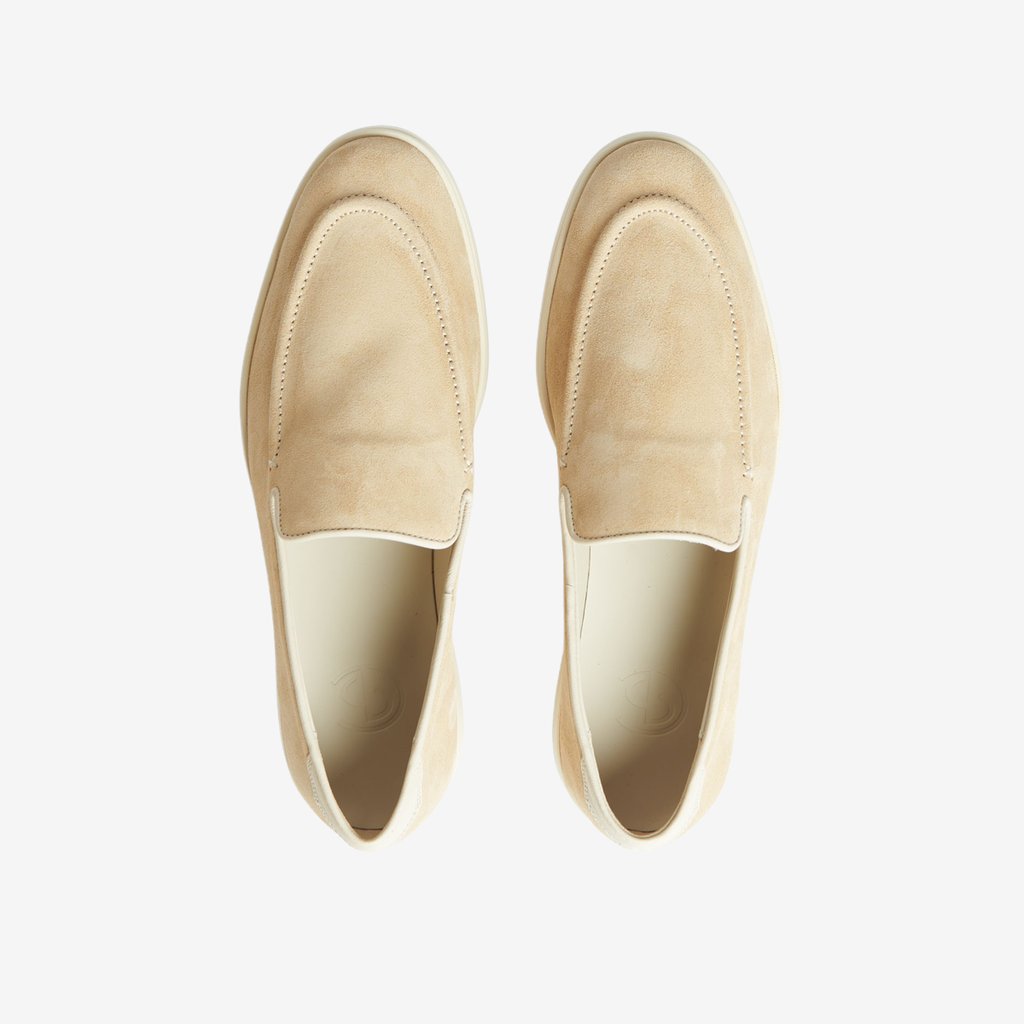 A pair of Sand Beige Suede Slip On Sneakers by CQP on a white surface.