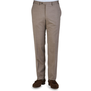A pair of beige Canali dress trousers displayed without the upper part of the body visible.