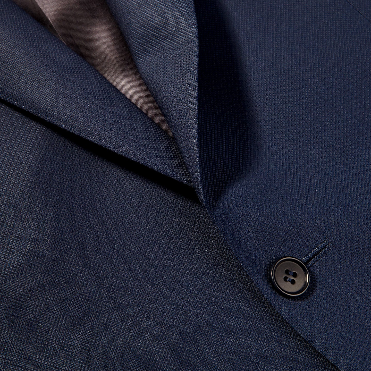 A close up image of the Canali Blue Wool Hopsack Travel Blazer featuring natural stretch.