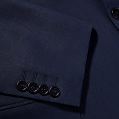 A close up of the wrinkle resistant buttons on a Canali Blue Wool Hopsack Travel Blazer.