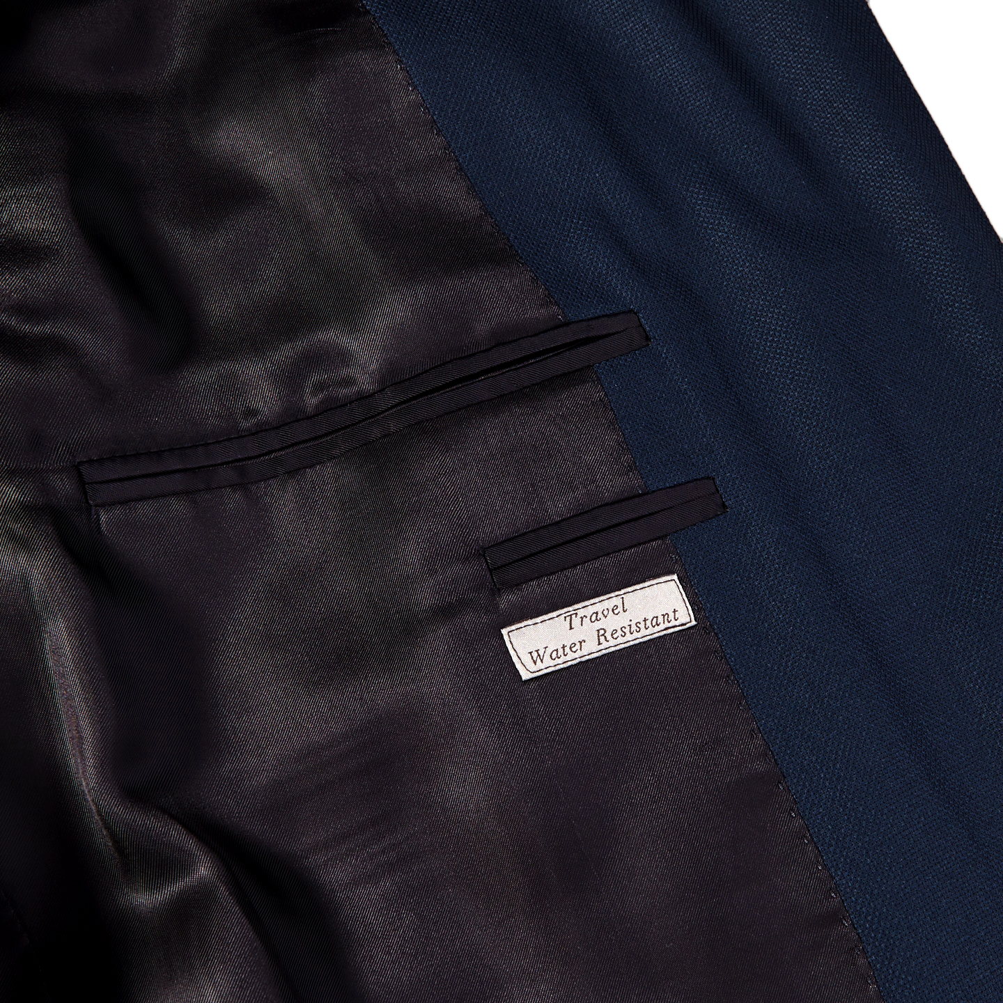 A close up of a Canali Blue Wool Hopsack Travel Blazer, which is wrinkle-resistant and stain repellent.