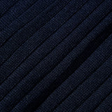 A close up image of Canali navy ribbed cotton socks made from dark blue Egyptian cotton fabric.